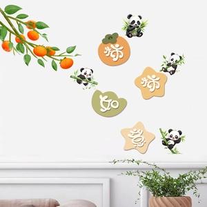 Detail of cartoon panda wall stickers with persimmons and Chinese characters on a white wall