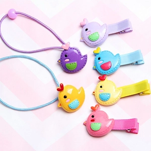 Close-up of colorful resin chick hair accessories including clips and elastic hair bands