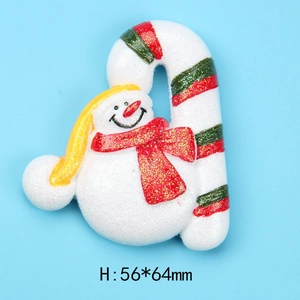Close-up of glittery resin snowman and candy cane Christmas DIY accessory 56x64mm