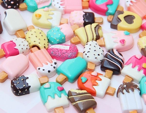 Close-up of colorful resin popsicle charms for DIY phone cases and hair accessories