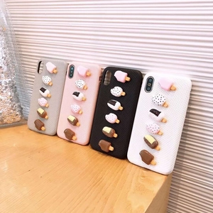 Detailed view of 3D resin popsicle ornaments on stylish woven texture phone cases