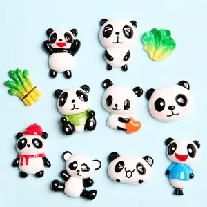 Flat lay of diverse resin panda charms and vegetable shapes for DIY crafts and phone cases