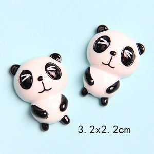 Macro detail of glossy resin panda charms for DIY crafts with 3.2x2.2cm size marked
