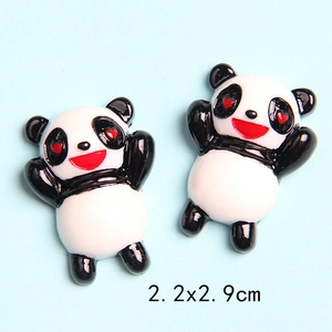 Detailed close-up of 2.2x2.9cm panda resin charms with red heart eyes for DIY crafts