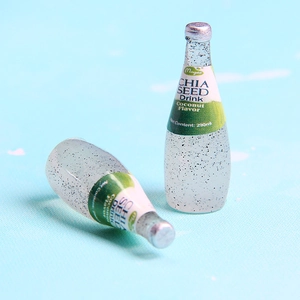 Detailed close-up of miniature coconut chia seed drink bottles for DIY crafts and dollhouses