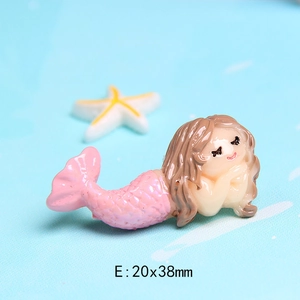 Macro view of a cute pink resin mermaid accessory for DIY crafts size 20x38mm