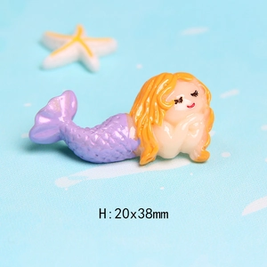 Macro detail of cute resin mermaid figure for DIY crafts with 20x38mm size labels