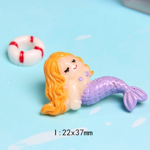 Detailed macro view of 22x37mm resin mermaid miniature with purple tail for DIY crafts