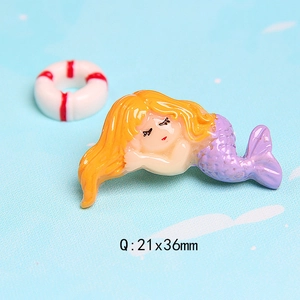 Detailed macro view of DIY resin mermaid and lifesaver charm sized 21x36mm for crafts