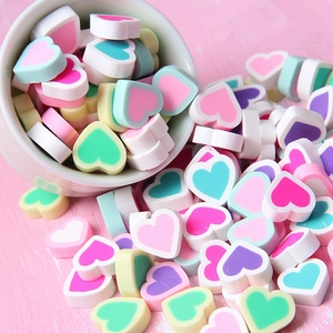 Macro detail of heart-shaped macaron clay charms for DIY crafts and phone case decor