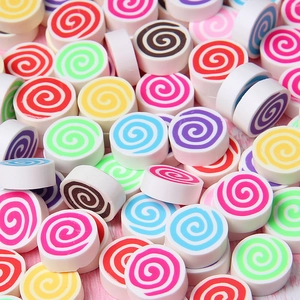Macro shot of colorful spiral polymer clay marshmallow charms for DIY craft decorations