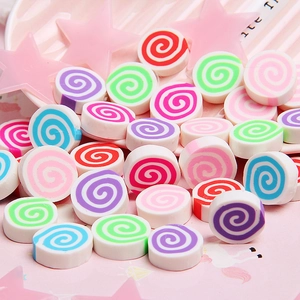Macro shot of colorful spiral polymer clay marshmallow charms for DIY craft decoration