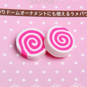 Detail view of pink and white spiral resin charms for DIY craft and phone case decor