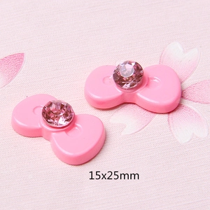 Detail van 15x25mm roze hars strik met strassteen voor DIY-haaraccessoires decoratie