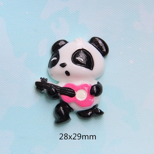 Macro view of panda resin charm with pink guitar for DIY crafts and phone case deco