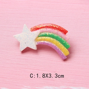 Detail showing colorful resin star and rainbow DIY accessory with glitter finish, 1.8x3.3cm