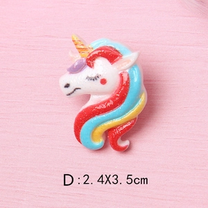 Macro detail of glitter unicorn resin charm measuring 2.4x3.5cm for DIY crafts