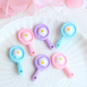 Detailed view of colorful resin fried egg pans for DIY jewelry and dollhouse crafts