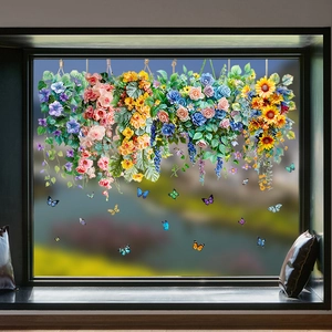Detailed view of colorful sunflower vine and butterfly static window clings on glass