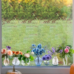 Close-up of decorative floral window static clings with hydrangea and lavender designs