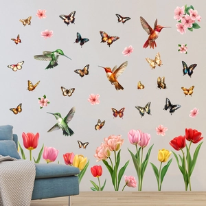 Detailed wall sticker layout featuring hummingbirds and colorful tulips on a grey wall