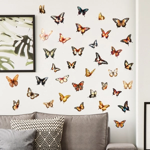 Realistic 3D butterfly wall decals with vibrant patterns on a modern white living room wall