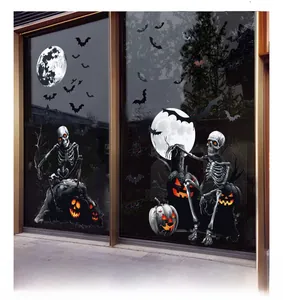 Detail of Halloween window clings featuring glowing pumpkins, skeletons, and bats