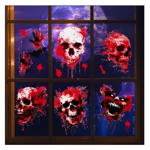Detail of Halloween window clings featuring blood skulls, handprints and monster face