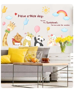 Detailed view of colorful cartoon animal wall stickers applied to a cozy living room wall