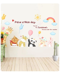 Detailed view of cartoon animal wall stickers with giraffe panda and sun in kids room decor