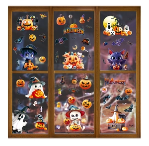 Detail of cute Halloween window clings with pumpkin, ghost and bat motifs on glass