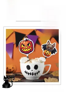 Halloween pumpkin and bat cupcake toppers set in a skull mug filled with marshmallows
