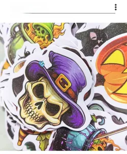 Close-up of glitter Halloween stickers featuring skulls, pumpkins and black cats detail