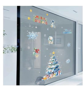 Watercolor Christmas window stickers showing blue tree and gifts on glass