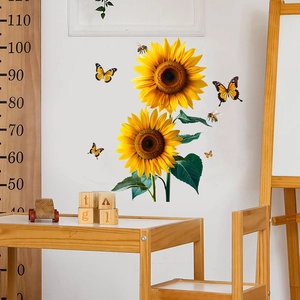 Detail of sunflower wall decals with yellow butterflies and bees in a cozy room setting