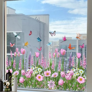 Detail of tulip and butterfly static cling window stickers on a glass balcony door