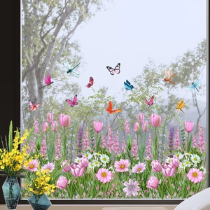 Detailed view of tulip and butterfly static window stickers on a glass surface