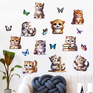 Detail of 10 cat and butterfly waterproof wall stickers on white wall above gray sofa