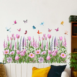 Detailed garden wall stickers with tulips and butterflies over a white sofa in a living room