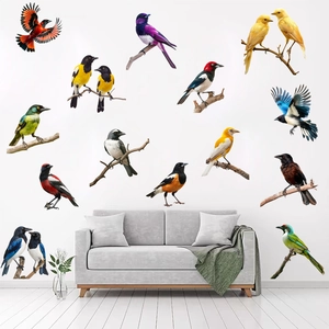 Detailed close-up of 13 realistic colorful bird wall decals on a minimalist white living room wall