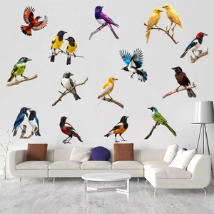 Realistic birds and branches wall decals displayed in a modern white living room setting