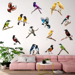 Detail view of colorful magpie and parrot wall stickers in a cozy modern living room