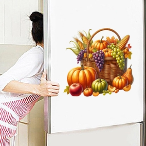Detail of harvest fruit basket wall sticker with pumpkin and grapes on a fridge