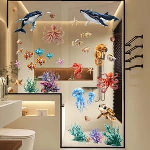 Detail view of colorful whale and sea turtle static stickers on bathroom glass doors