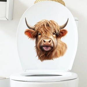Sticker vache des Highlands réaliste appliqué sur un abattant de WC blanc brillant