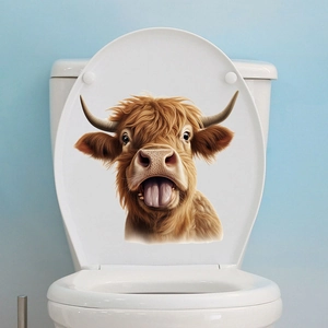 Gros plan d'un autocollant de vache des Highlands rigolo sur un abattant de WC