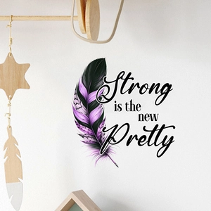 Detail view of purple feather wall decal with Strong is the new Pretty art lettering
