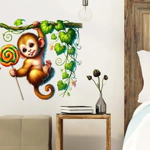 Cartoon monkey wall sticker with vines and rainbow lollipop on a cozy bedroom wall