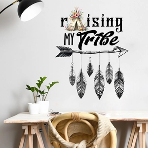 Detail of tribal wall sticker with Raising My Tribe text, teepee and feathers on white wall