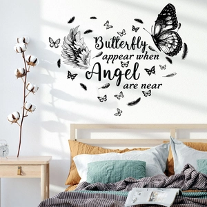 Detail of waterproof butterfly heart wall decal with artistic text on bedroom wall